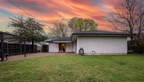 a front view of house with yard and seating area