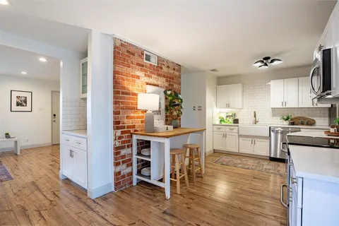 a kitchen with a table and chairs in it