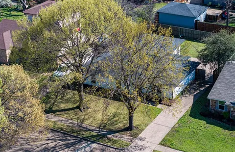 a backyard of a house with lots of green space