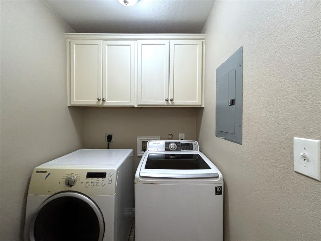 9461 Timberleaf Drive Dallas, TX 75243 - Photo 26 of 32 a utility room with dryer and washer