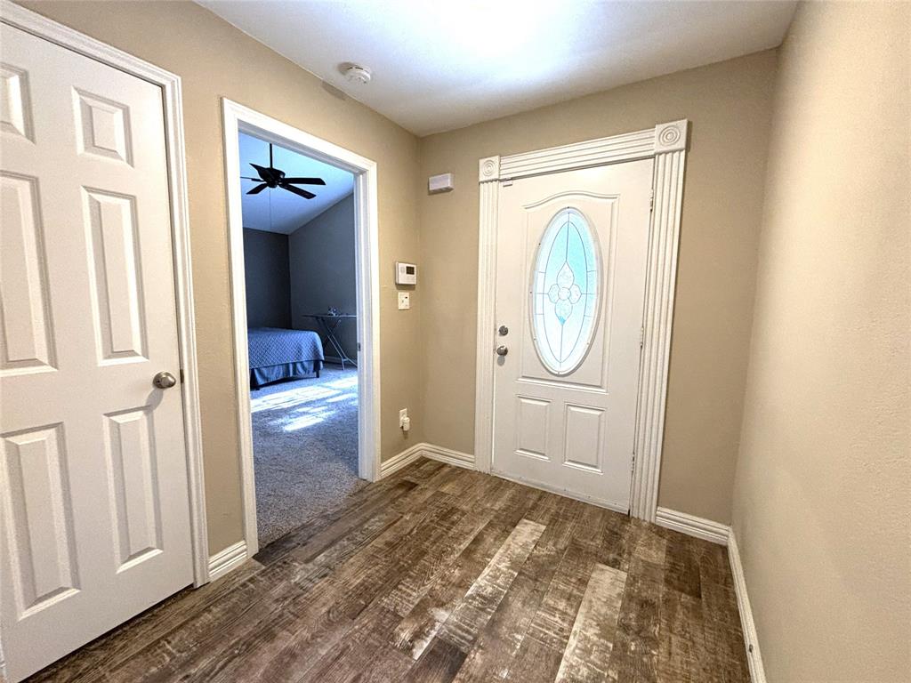 9461 Timberleaf Drive Dallas, TX 75243 - Photo 4 of 32 a view of a hallway to rooms