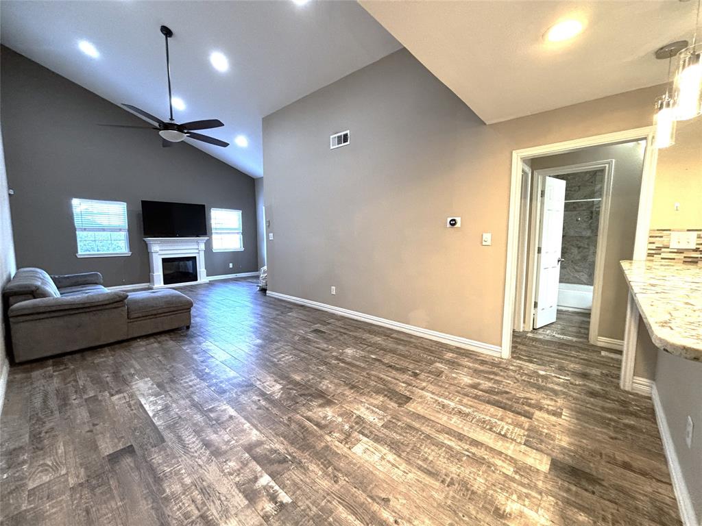 9461 Timberleaf Drive Dallas, TX 75243 - Photo 5 of 32 a living room with furniture and a flat screen tv