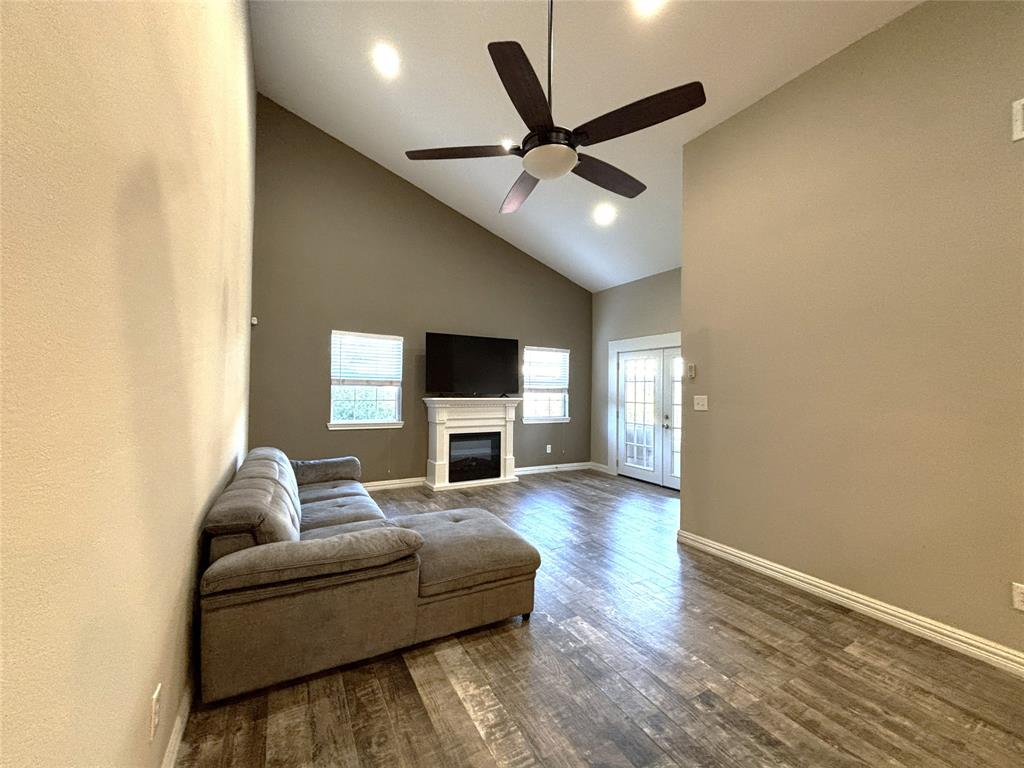 9461 Timberleaf Drive Dallas, TX 75243 - Photo 7 of 32 a living room with furniture and a fireplace