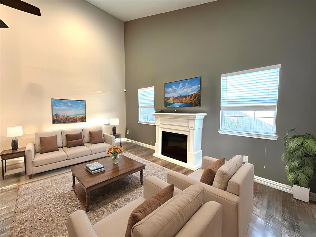 9461 Timberleaf Drive Dallas, TX 75243 - Photo 9 of 32 a living room with furniture or couch and a fireplace