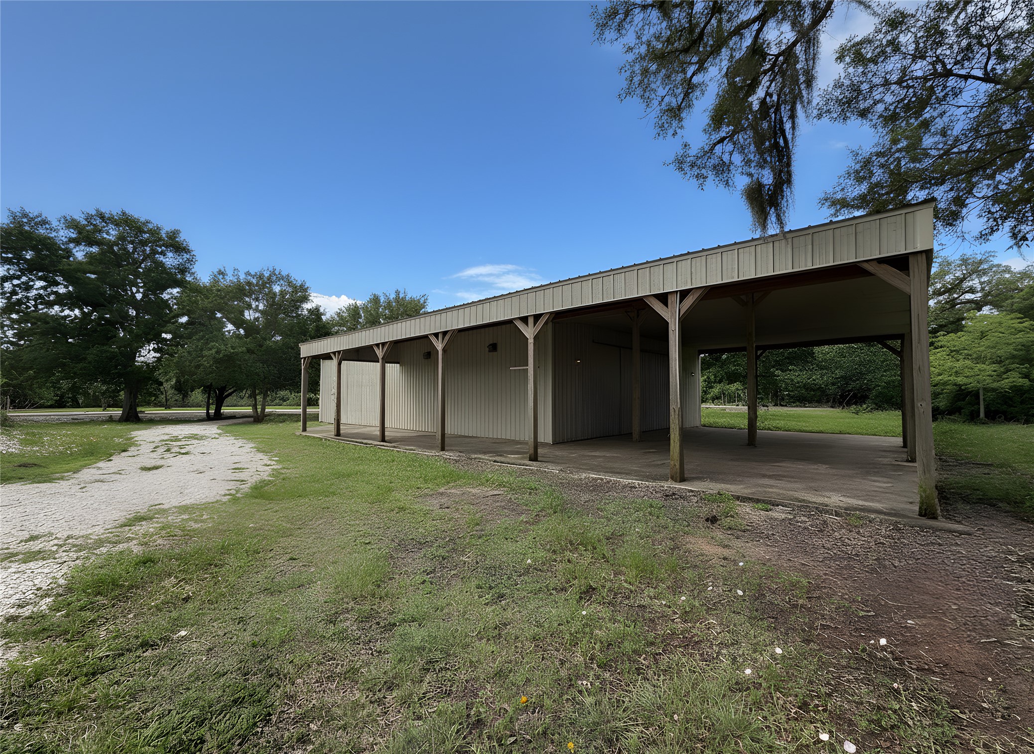 4680 County Road 611 Angleton, TX 77515 - Photo 3 of 9 a view of a backyard with large trees