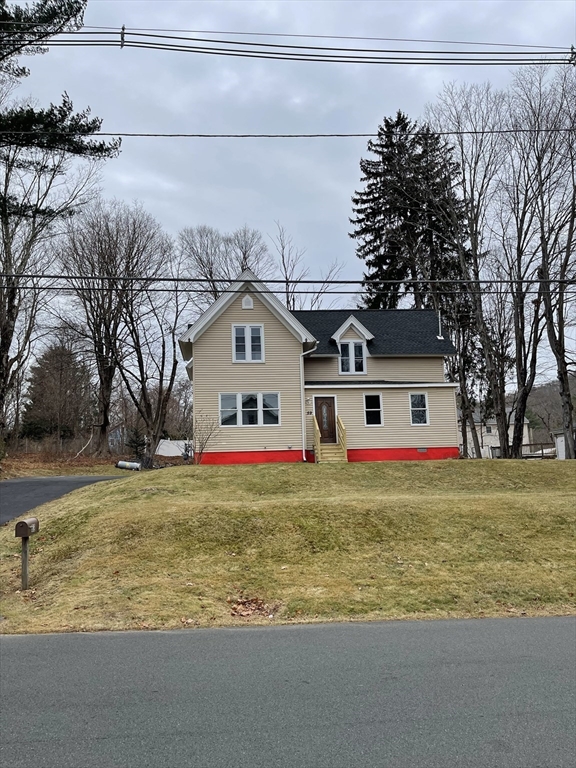 59 High Street Warren, MA 01083 - Photo 42 of 42 a front view of house with yard and trees around