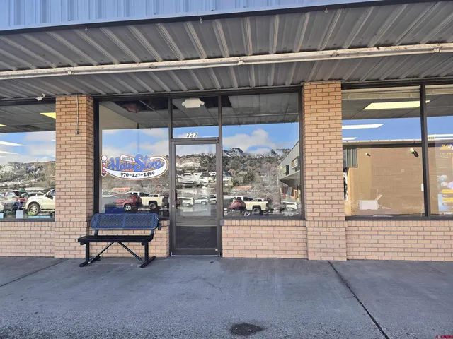 a view of a chairs and table in a room