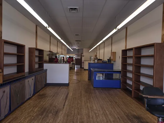 a view of kitchen with furniture and wooden floors
