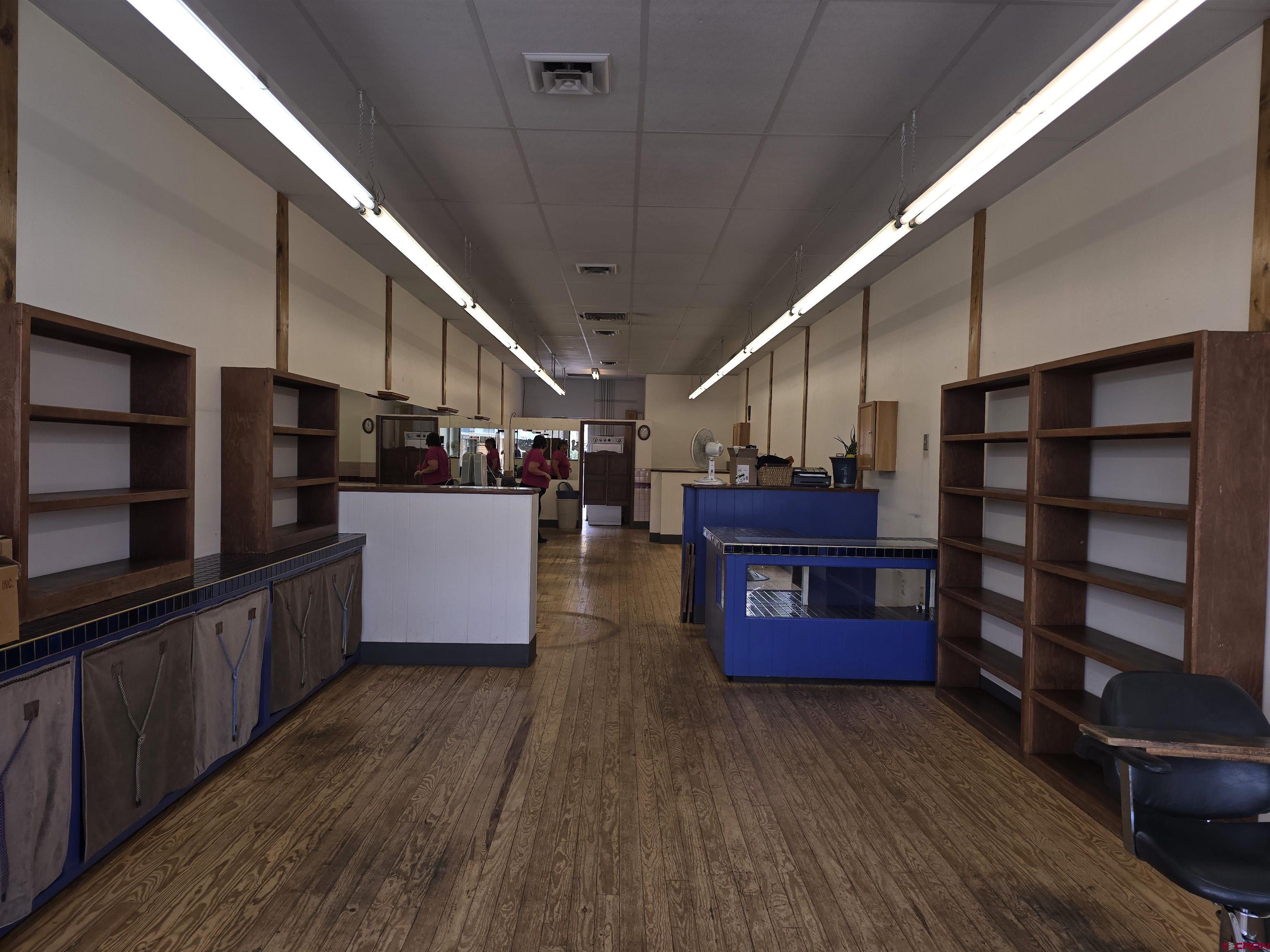 323 South Camino Del Rio, Unit SUITE L ( FORMER GENERAL HAIR CARE ) Durango, CO 81303 - Photo 4 of 9 a view of kitchen with furniture and wooden floors