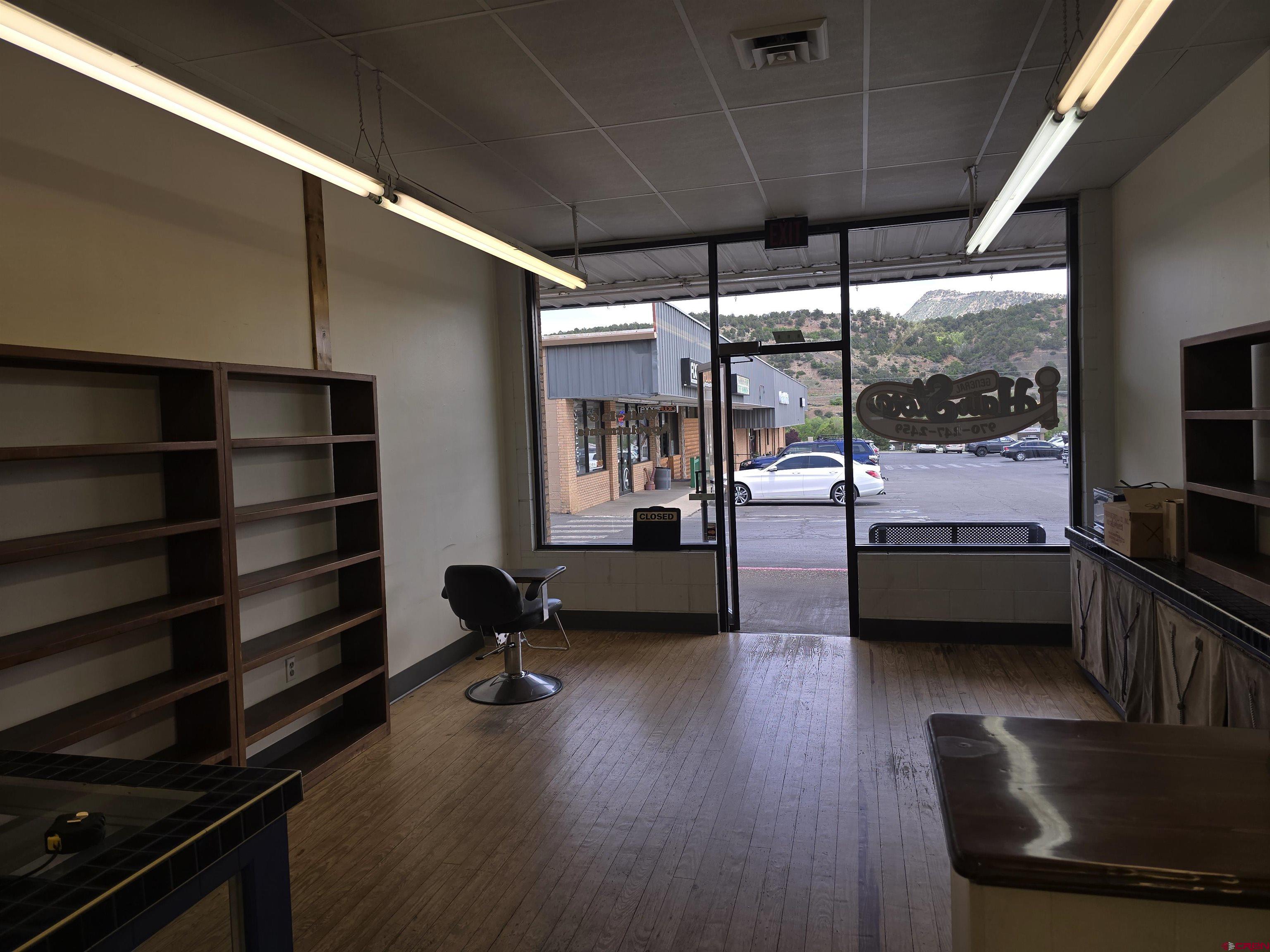 323 South Camino Del Rio, Unit SUITE L ( FORMER GENERAL HAIR CARE ) Durango, CO 81303 - Photo 5 of 9 a bedroom with furniture wooden floor and window