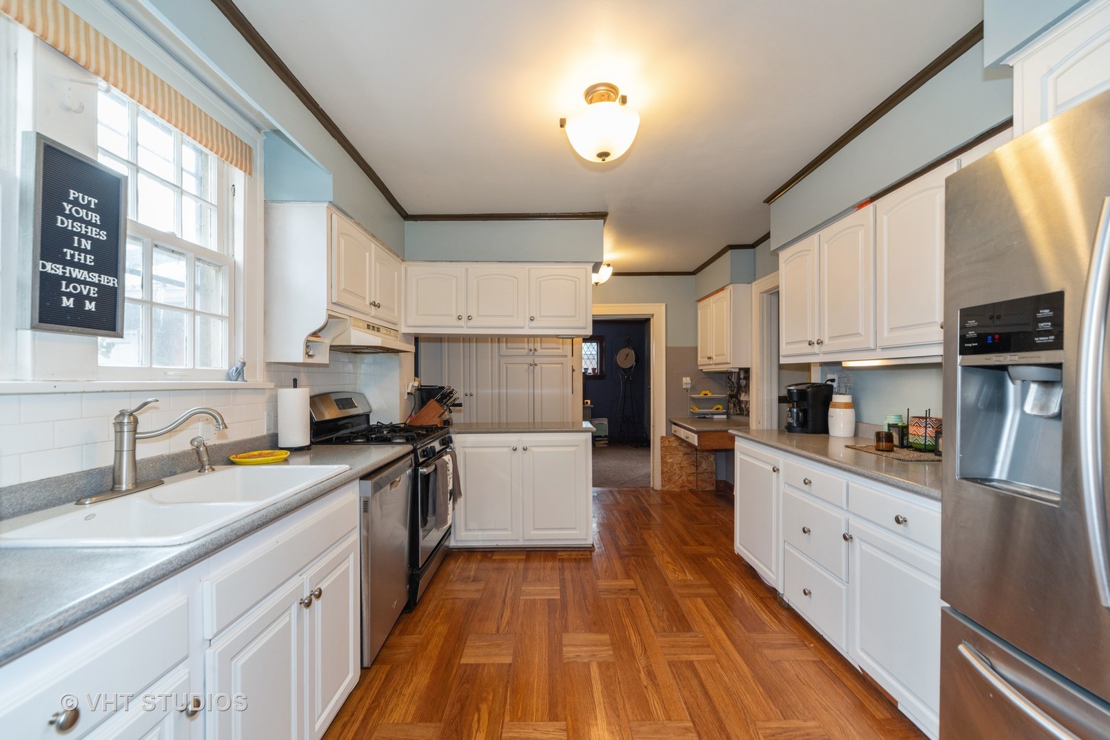 749 Elmore Street Park Ridge, IL 60068 - Photo 4 of 10 a kitchen with stainless steel appliances granite countertop a sink and cabinets