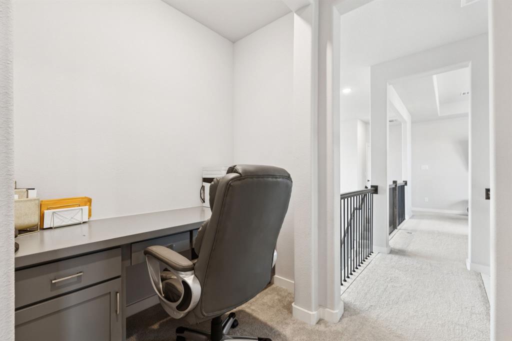 2805 Tower Road Mansfield, TX 76063 - Photo 17 of 33 a view of a hallway with workspace and couch