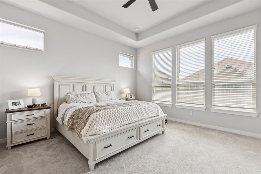 2805 Tower Road Mansfield, TX 76063 - Photo 18 of 33 a bed sitting in a bedroom next to a window