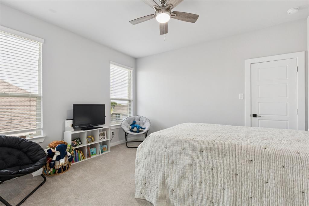 2805 Tower Road Mansfield, TX 76063 - Photo 20 of 33 a bedroom with a bed and a flat screen tv