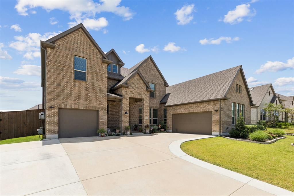 2805 Tower Road Mansfield, TX 76063 - Photo 2 of 33 a front view of a house with a yard and garage
