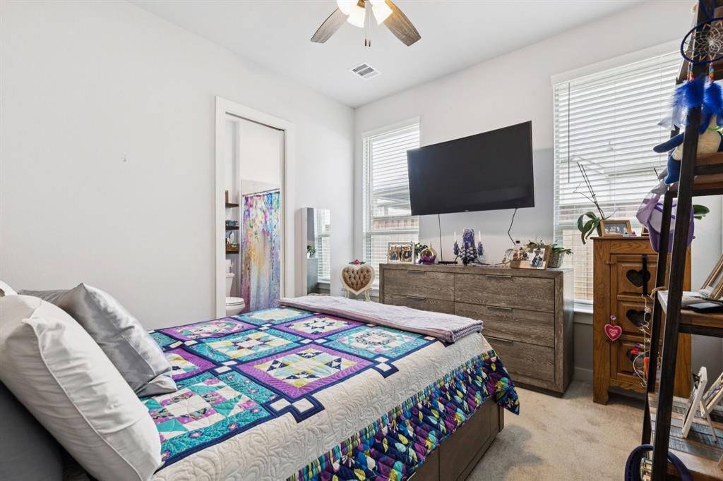 2805 Tower Road Mansfield, TX 76063 - Photo 23 of 33 a bedroom with a bed and a flat screen tv