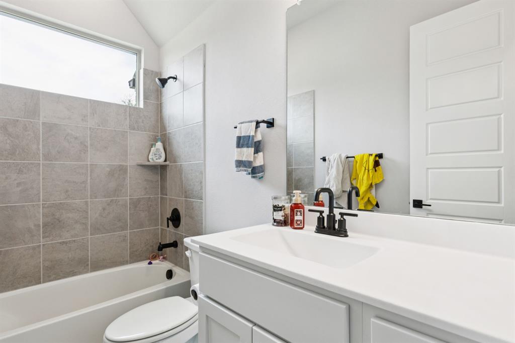 2805 Tower Road Mansfield, TX 76063 - Photo 28 of 33 a bathroom with a sink a toilet and shower