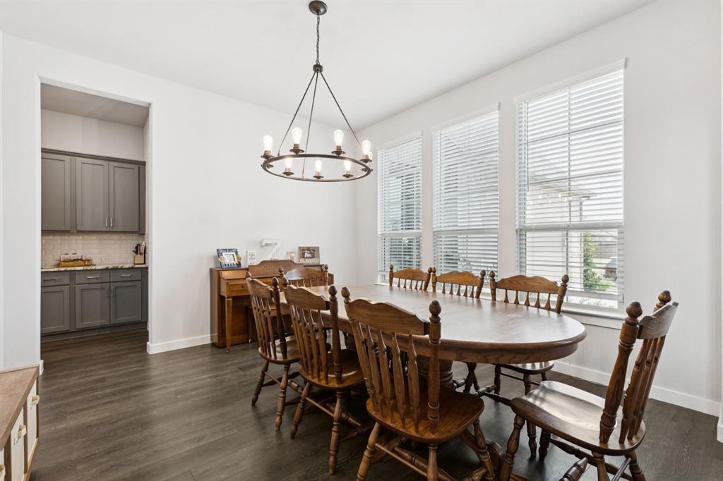 2805 Tower Road Mansfield, TX 76063 - Photo 4 of 33 a view of a dining room with furniture window and wooden floor