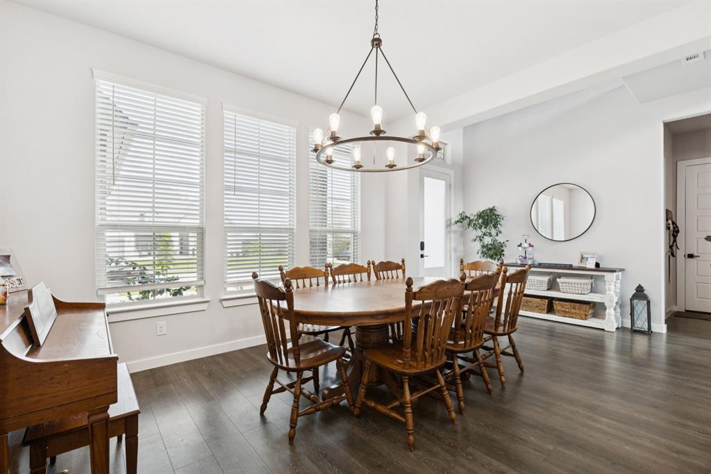 2805 Tower Road Mansfield, TX 76063 - Photo 5 of 33 a view of a dining room with furniture window and wooden floor