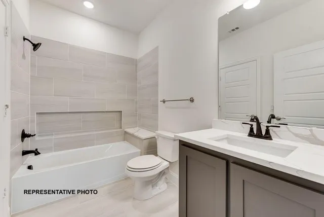 a bathroom with a sink a toilet and a bathtub