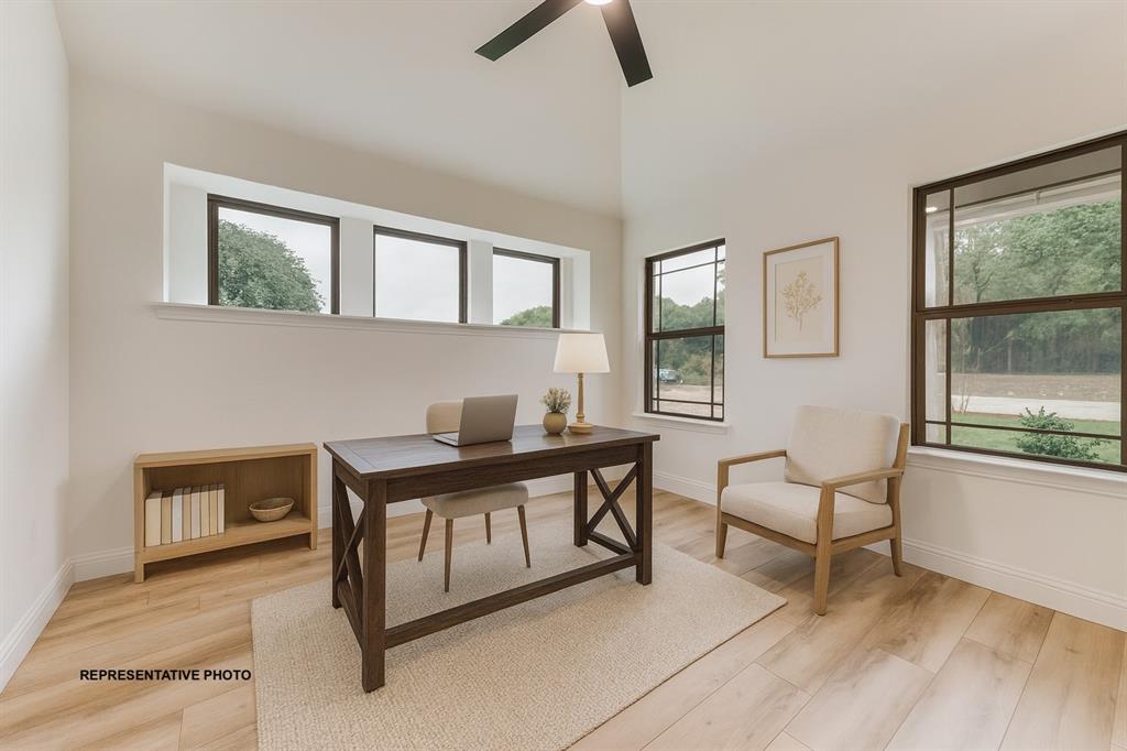 324 Skeen Peak Springtown, TX 76082 - Photo 3 of 14 a view of a workspace with furniture and window