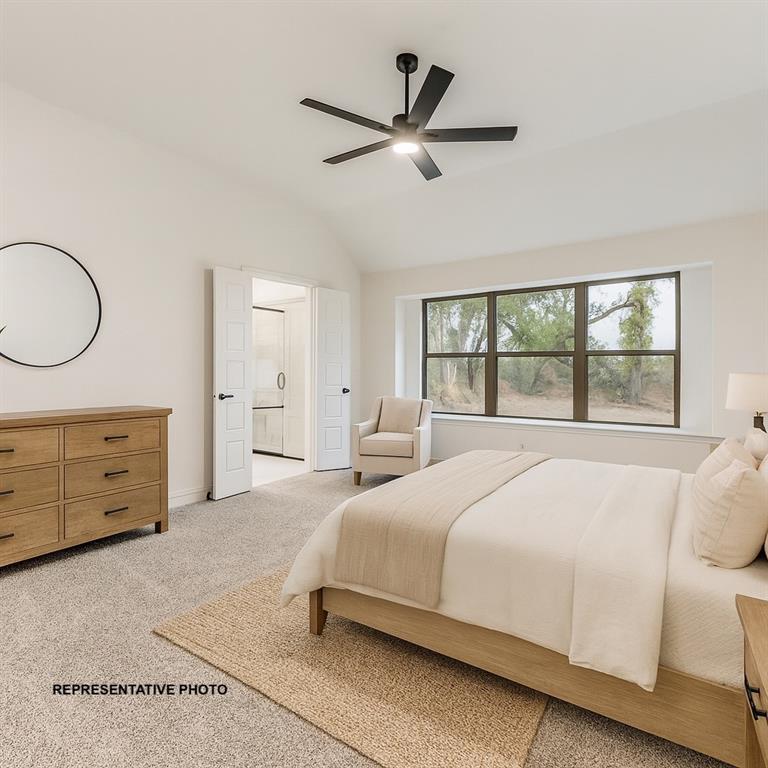 324 Skeen Peak Springtown, TX 76082 - Photo 8 of 14 a bedroom with a large bed and a window