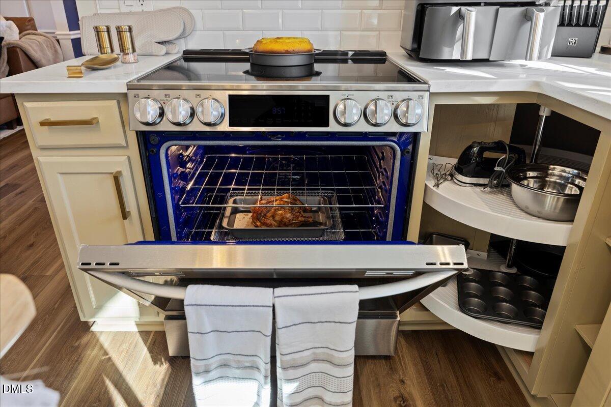 300 Pate Street Apex, NC 27502 - Photo 12 of 57 a stove top oven sitting inside of a kitchen