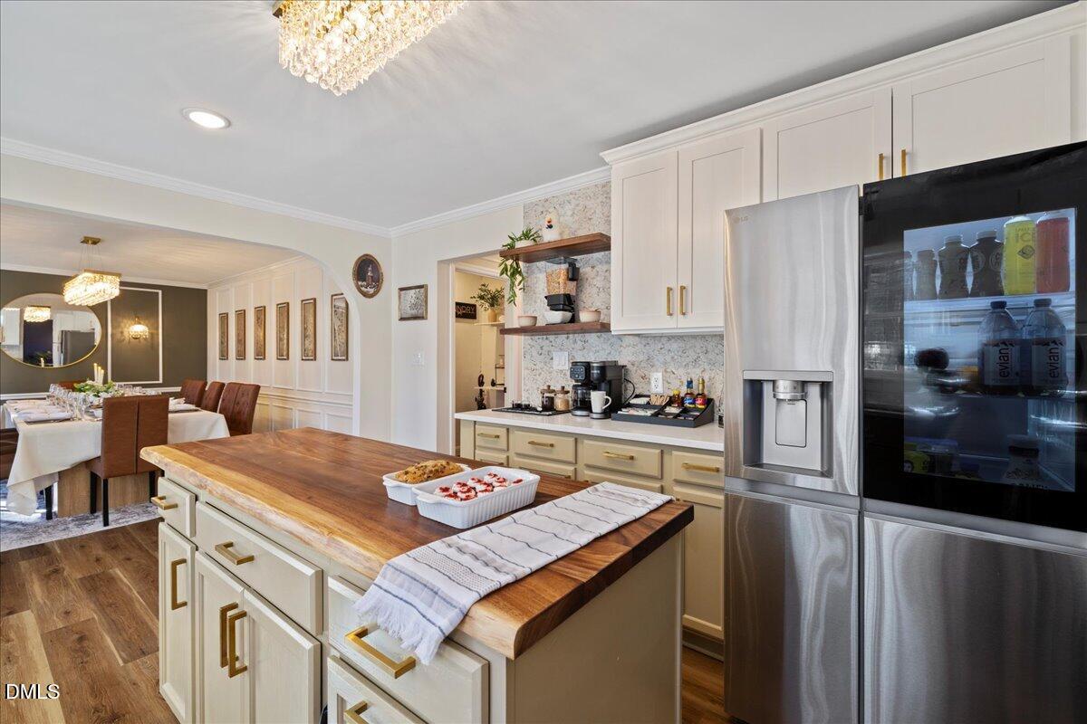 300 Pate Street Apex, NC 27502 - Photo 15 of 57 a kitchen with a sink stove and refrigerator