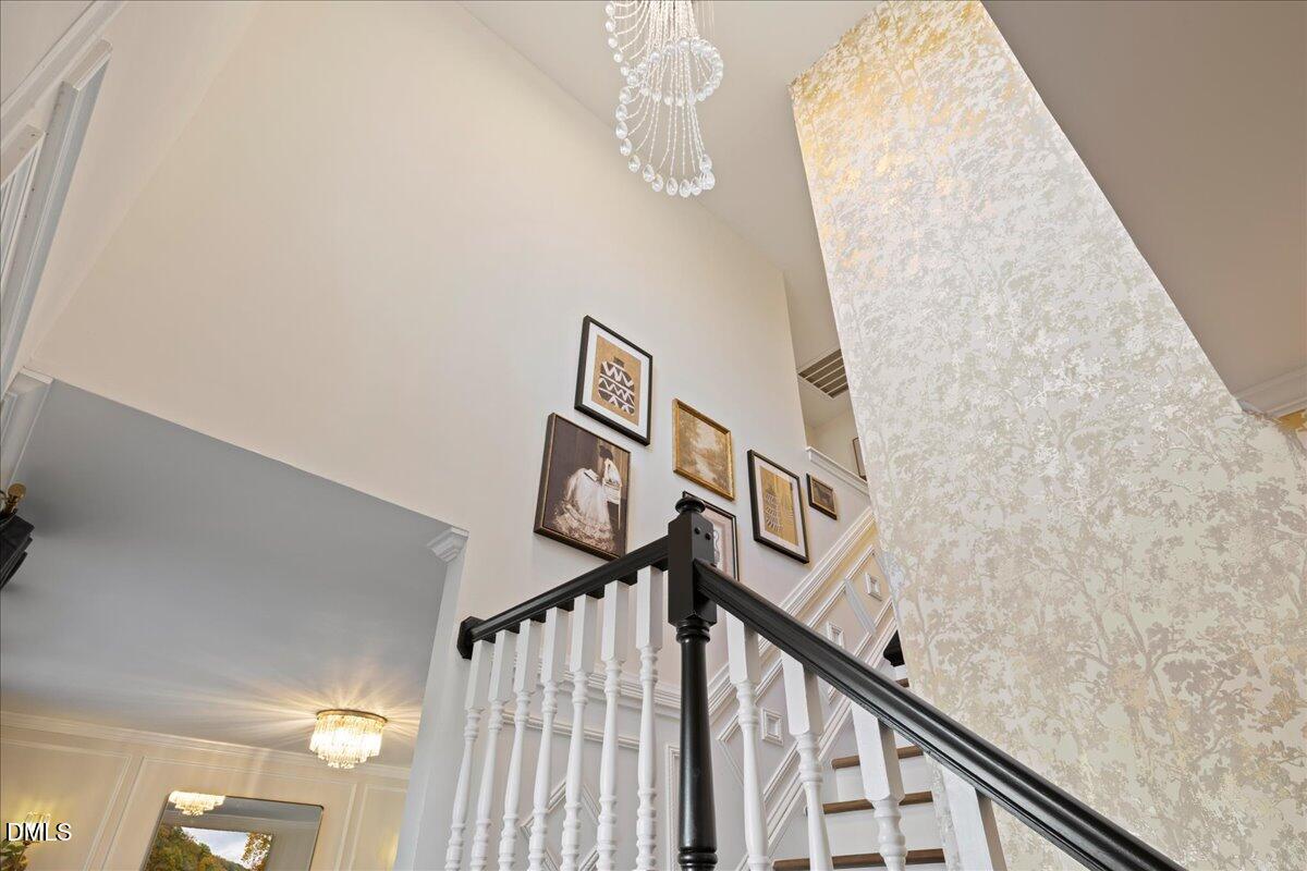 300 Pate Street Apex, NC 27502 - Photo 24 of 57 a view of staircase with lots of white walls