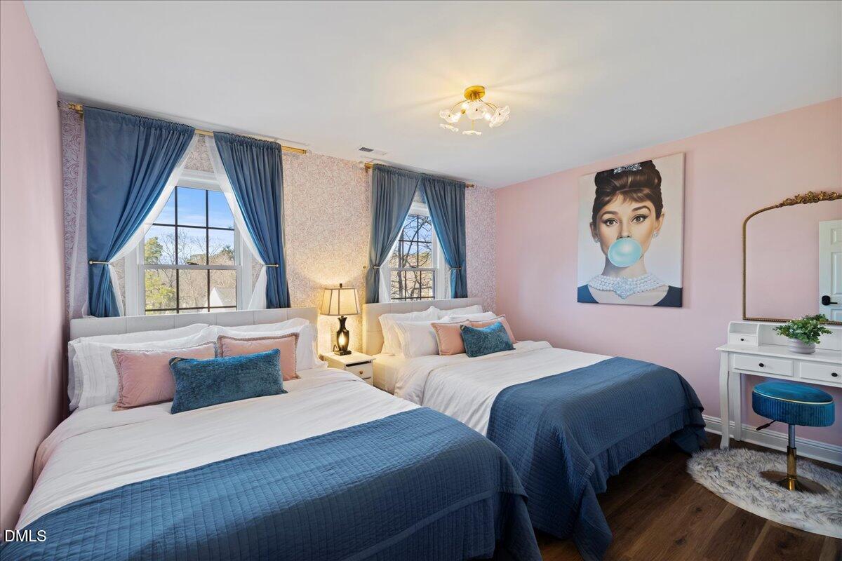 300 Pate Street Apex, NC 27502 - Photo 25 of 57 a bedroom with a bed and a window