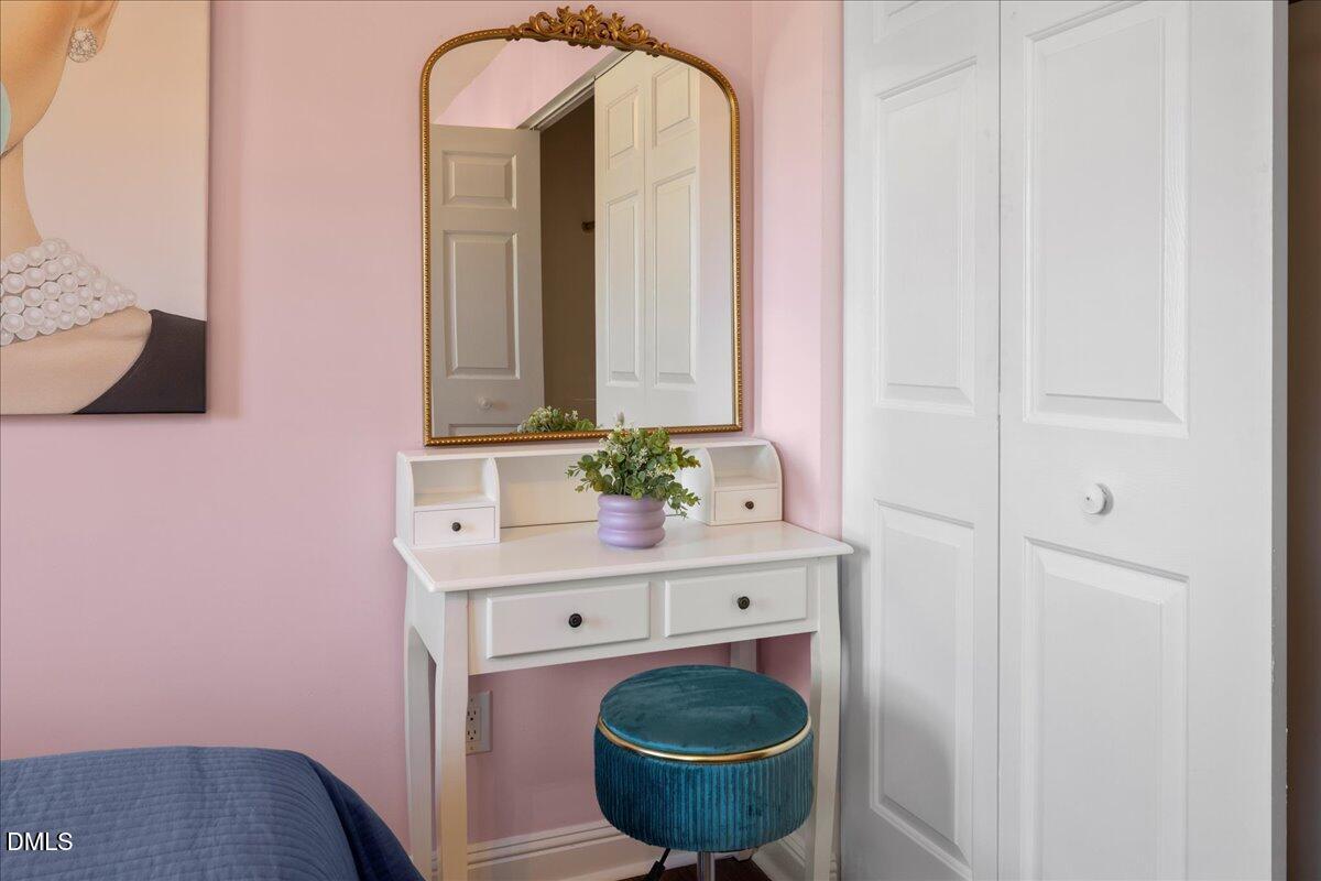 300 Pate Street Apex, NC 27502 - Photo 27 of 57 a bathroom with a sink a toilet and a mirror