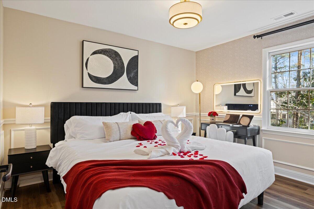 300 Pate Street Apex, NC 27502 - Photo 28 of 57 a bedroom with a bed and window