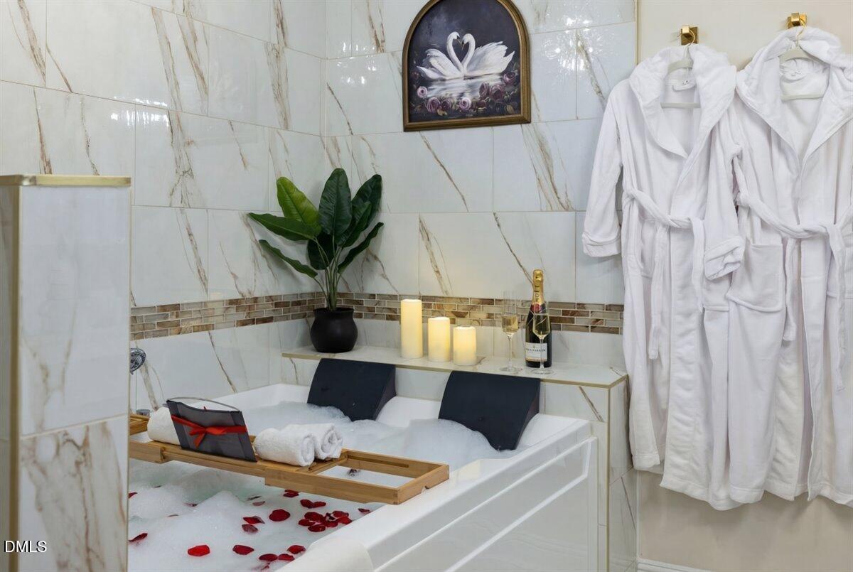 300 Pate Street Apex, NC 27502 - Photo 38 of 57 a table with a couch and a potted plant