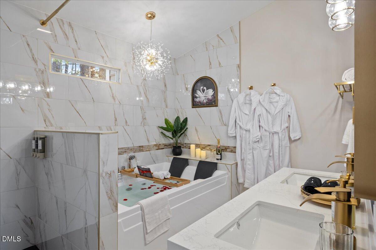 300 Pate Street Apex, NC 27502 - Photo 40 of 57 a room with a sink and a mirror