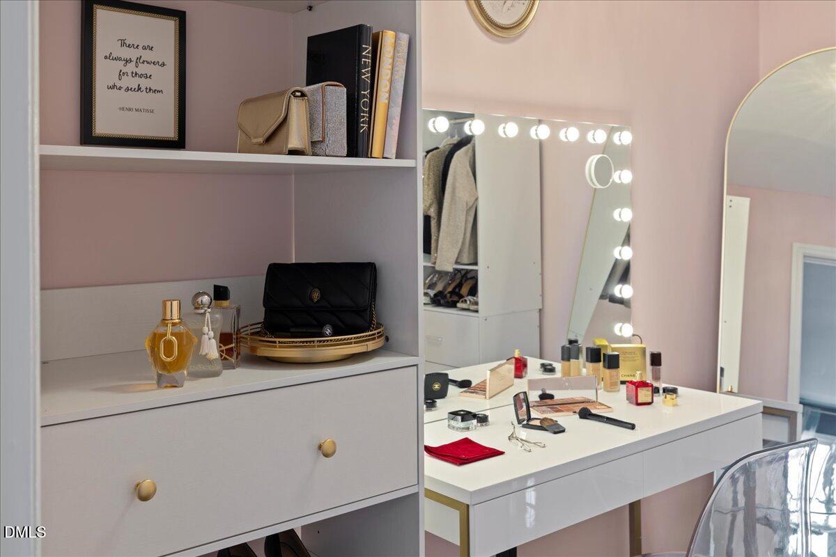 300 Pate Street Apex, NC 27502 - Photo 43 of 57 a bathroom with a sink and a mirror