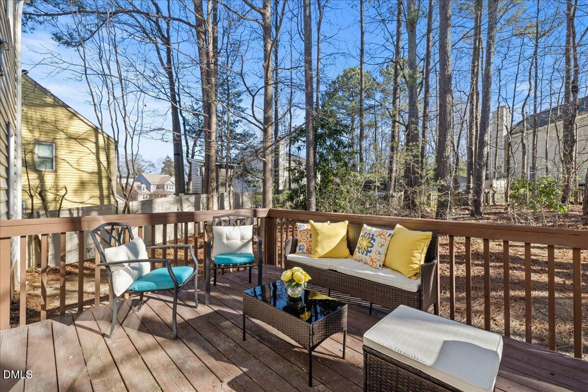 300 Pate Street Apex, NC 27502 - Photo 47 of 57 a roof deck with couches and wooden fence