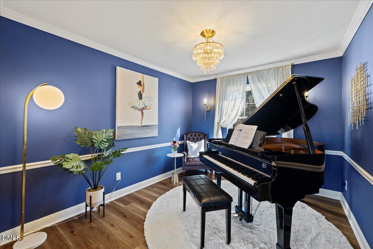 300 Pate Street Apex, NC 27502 - Photo 6 of 57 a living room with furniture and a piano