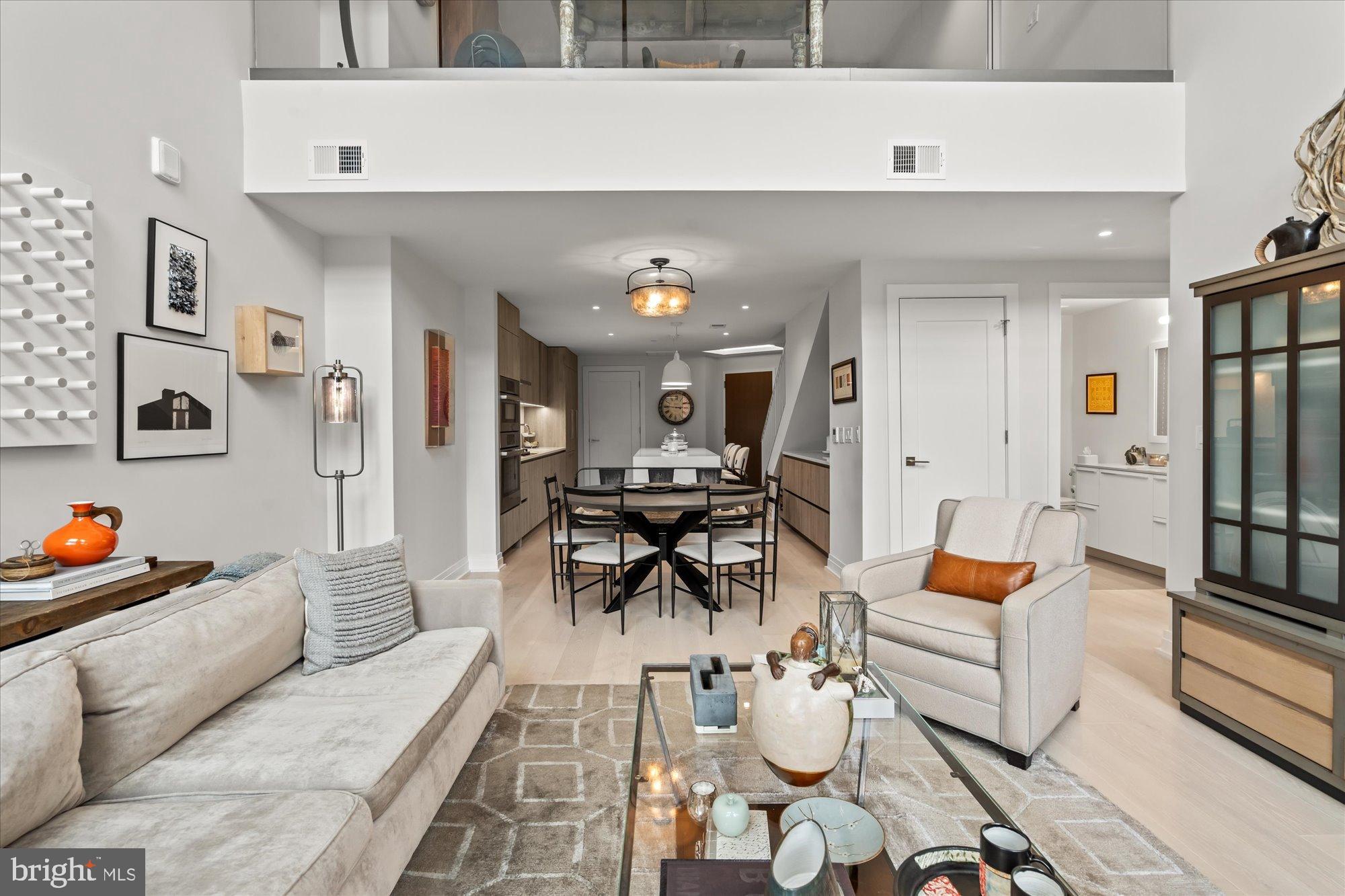 1201 North Royal Street, Unit 214 Alexandria, VA 22314 - Photo 11 of 71 a living room with furniture and wooden floor