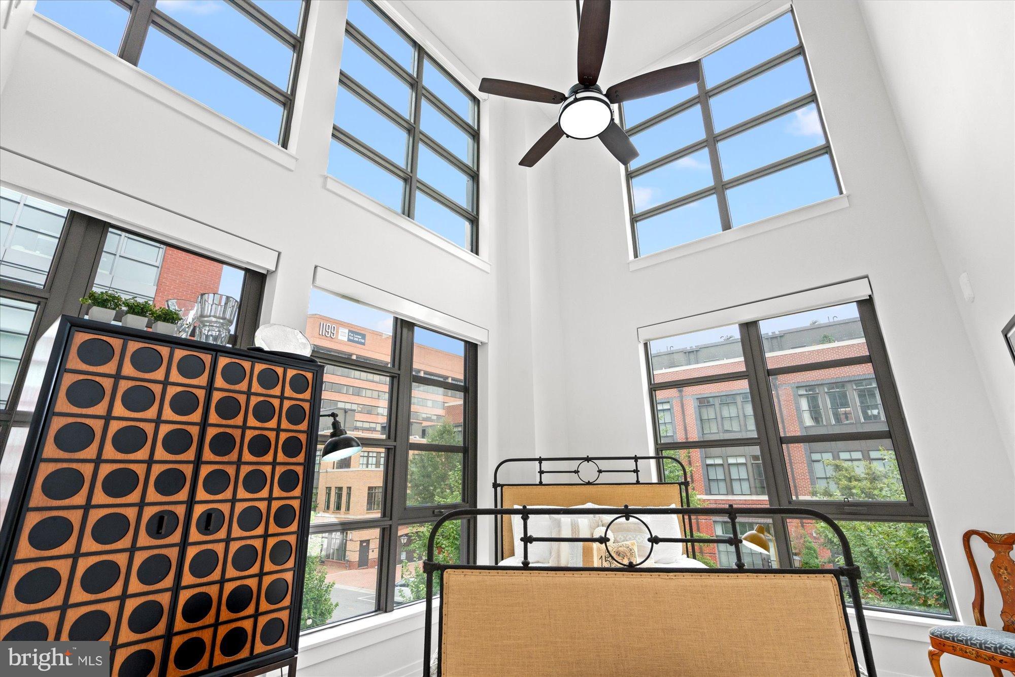 1201 North Royal Street, Unit 214 Alexandria, VA 22314 - Photo 16 of 71 a view of a balcony with furniture and a ceiling fan