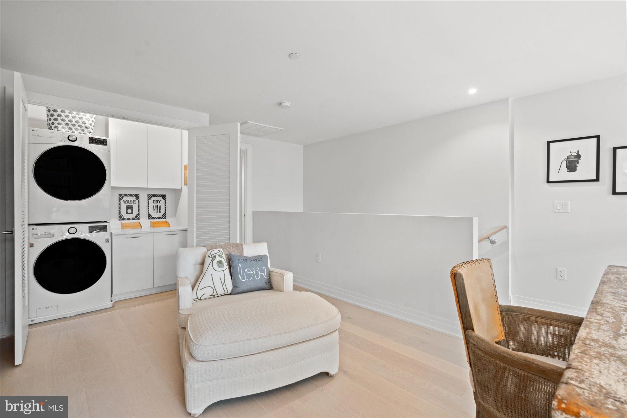 1201 North Royal Street, Unit 214 Alexandria, VA 22314 - Photo 29 of 71 Modern laundry nook with stylish charm.