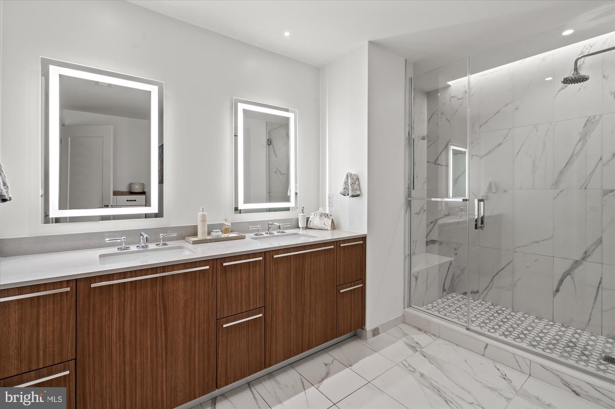 1201 North Royal Street, Unit 214 Alexandria, VA 22314 - Photo 33 of 71 a bathroom with a sink and a mirror