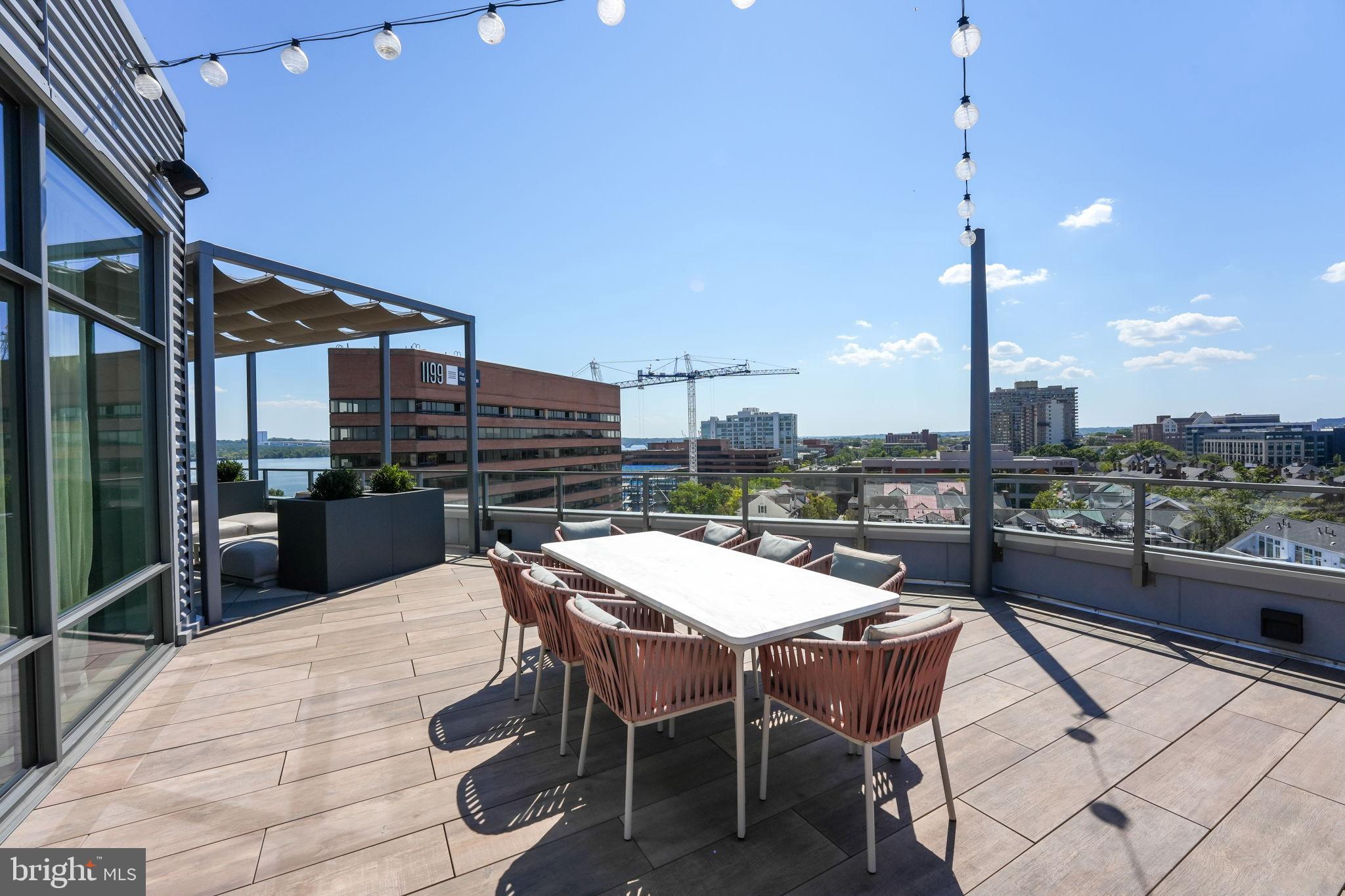 1201 North Royal Street, Unit 214 Alexandria, VA 22314 - Photo 42 of 71 a outdoor dining space with furniture and city view