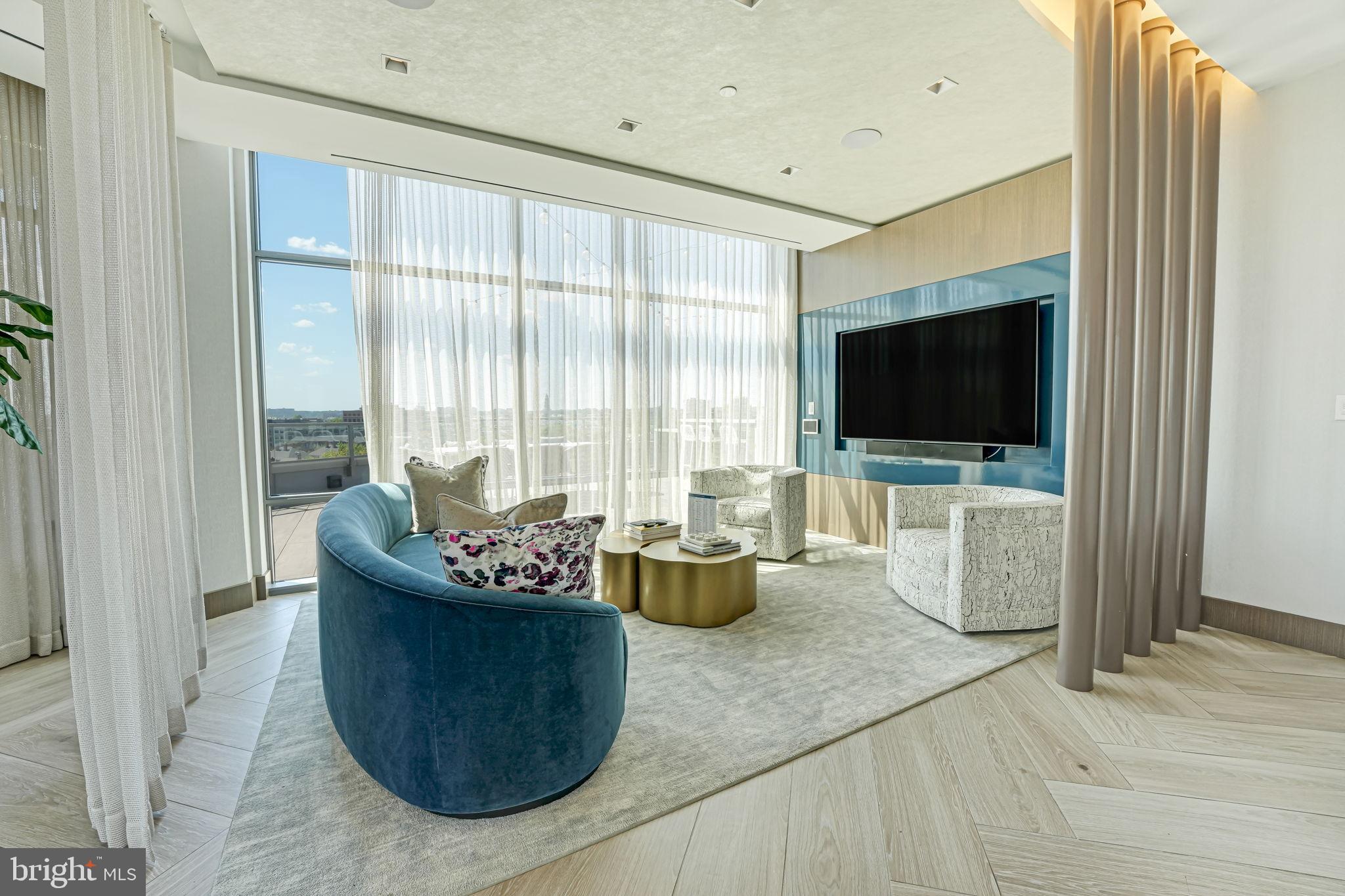 1201 North Royal Street, Unit 214 Alexandria, VA 22314 - Photo 58 of 71 a living room with furniture and a flat screen tv