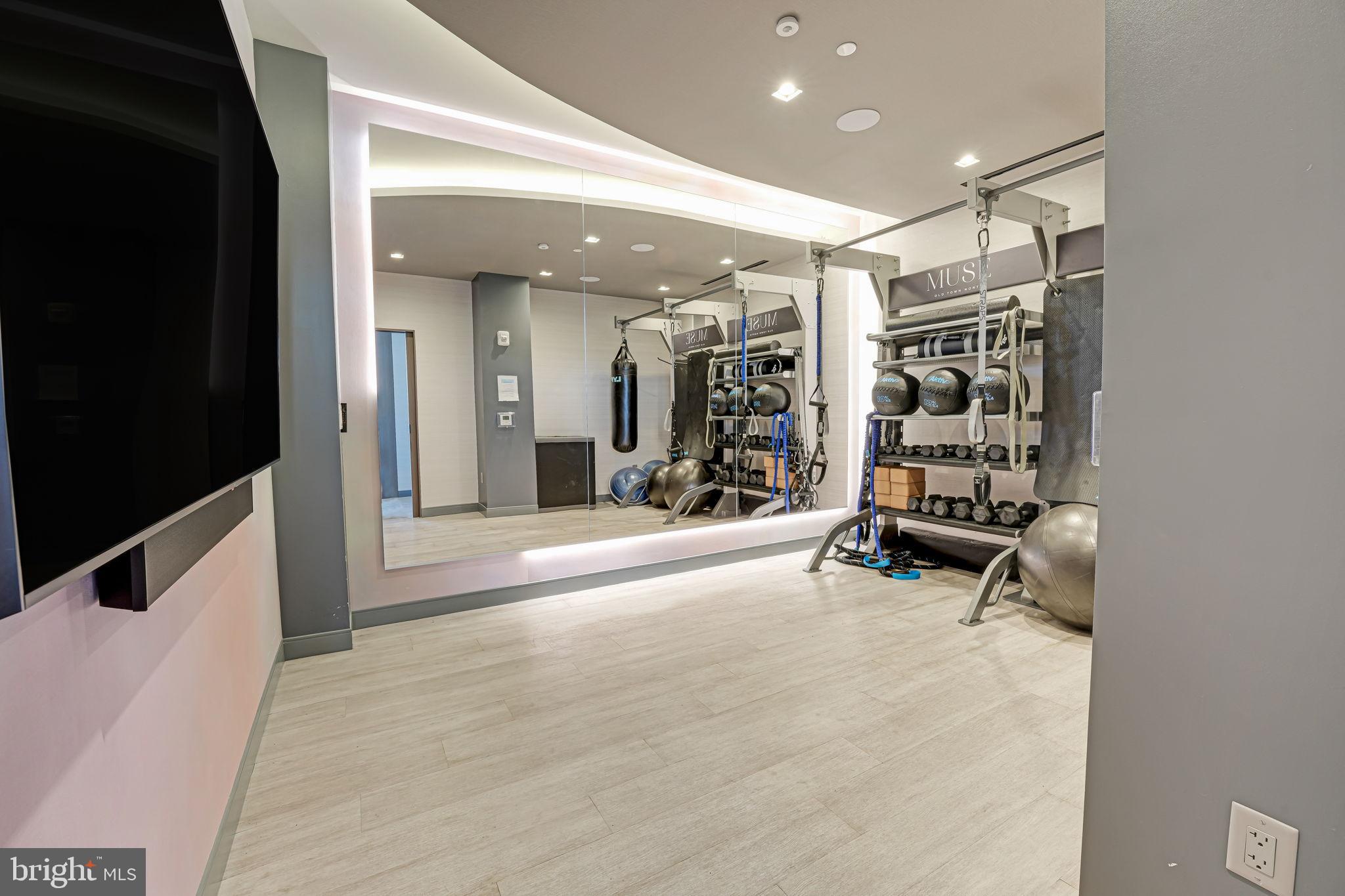 1201 North Royal Street, Unit 214 Alexandria, VA 22314 - Photo 63 of 71 Modern fitness space with sleek design.