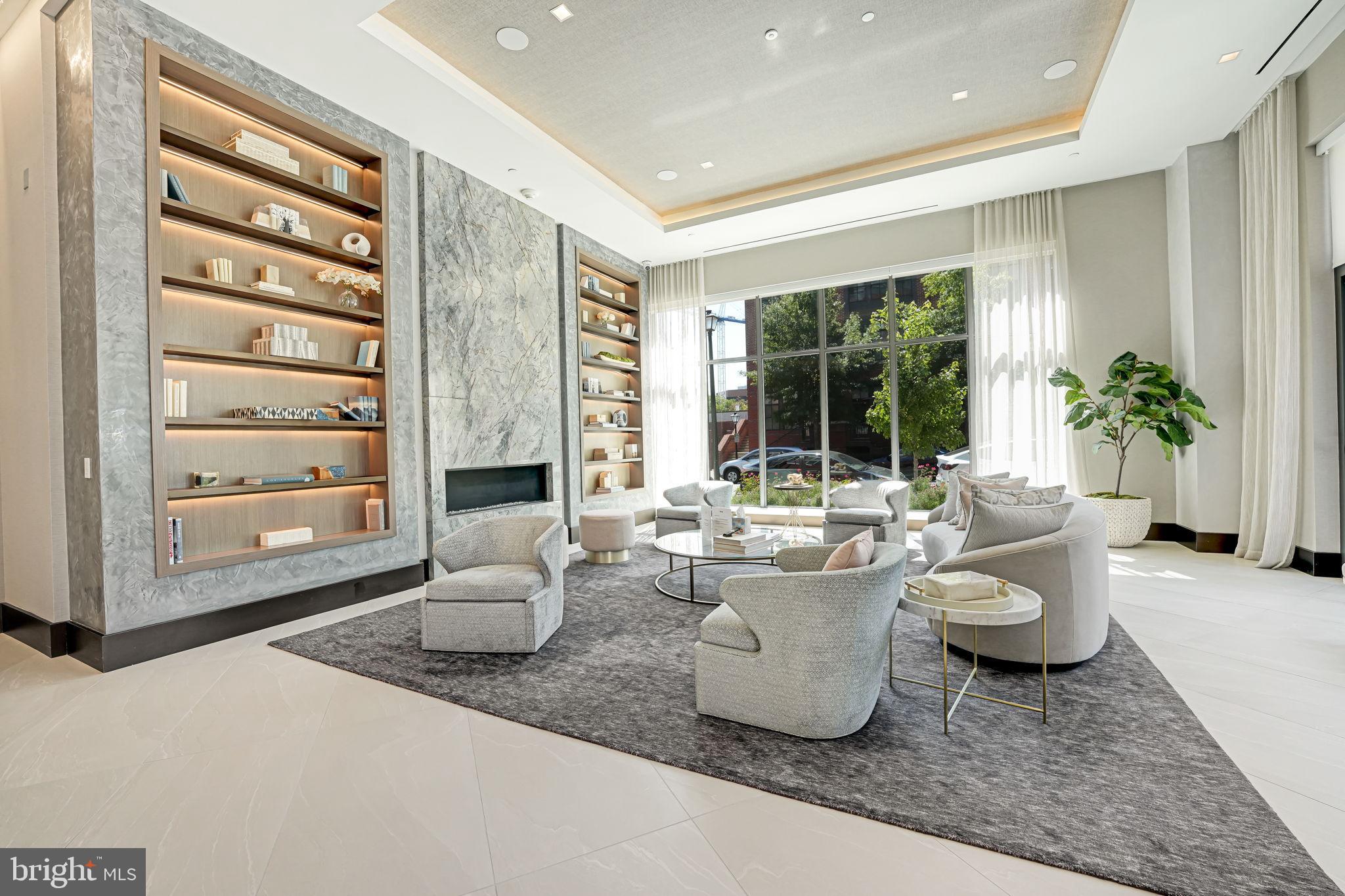 1201 North Royal Street, Unit 214 Alexandria, VA 22314 - Photo 64 of 71 a living room with furniture and a potted plant