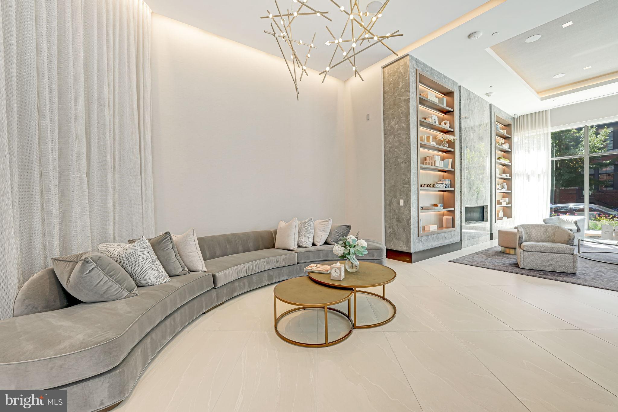 1201 North Royal Street, Unit 214 Alexandria, VA 22314 - Photo 65 of 71 a living room with furniture and a floor to ceiling window