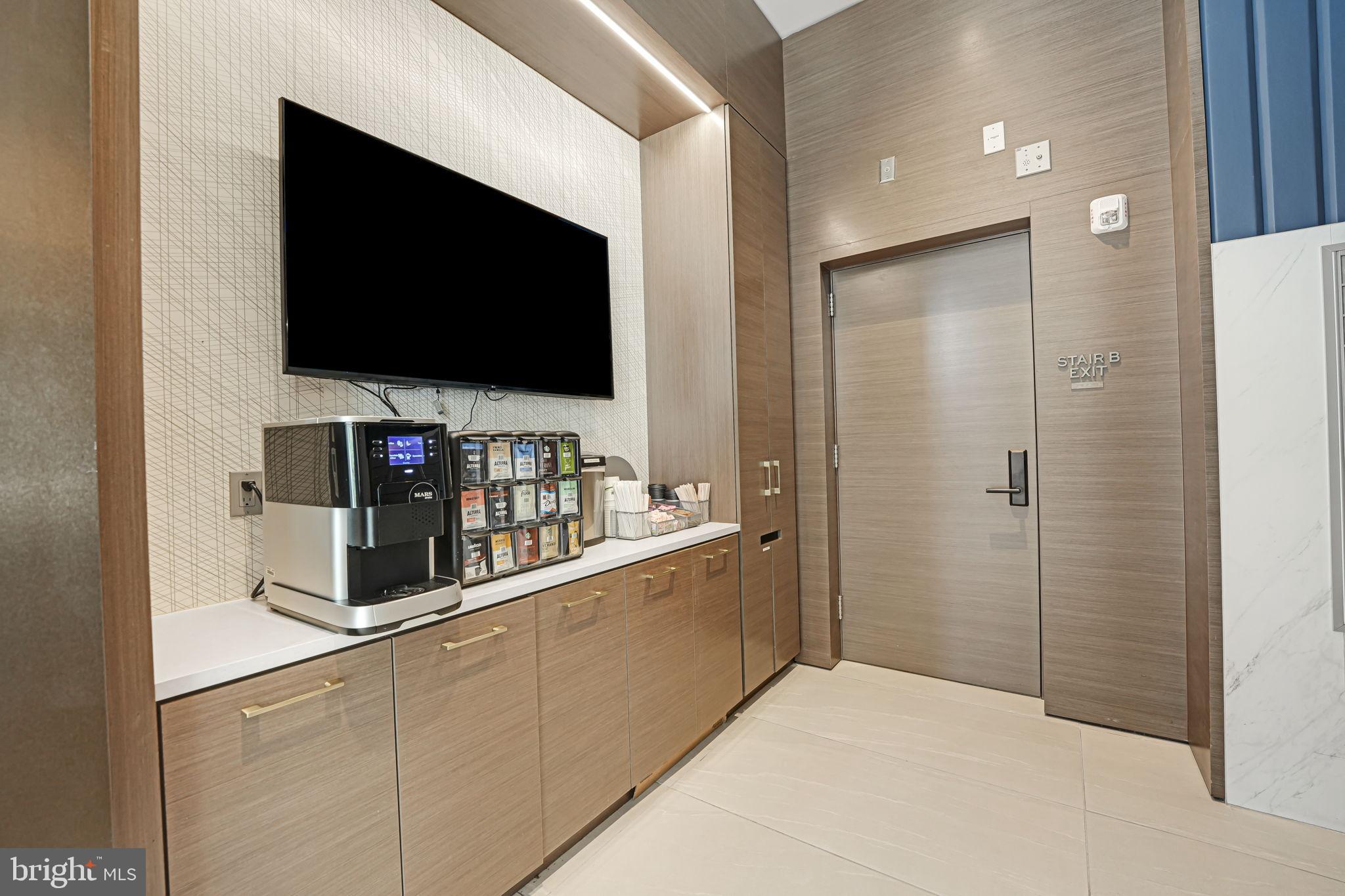 1201 North Royal Street, Unit 214 Alexandria, VA 22314 - Photo 66 of 71 Modern coffee station with sleek design.