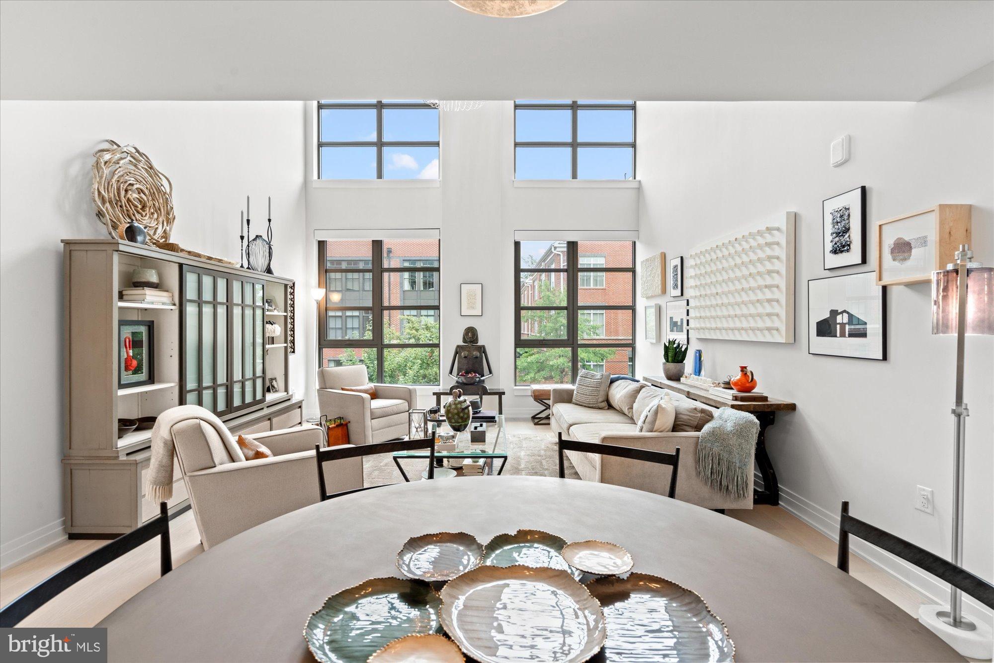 1201 North Royal Street, Unit 214 Alexandria, VA 22314 - Photo 7 of 71 a living room with furniture and a large window