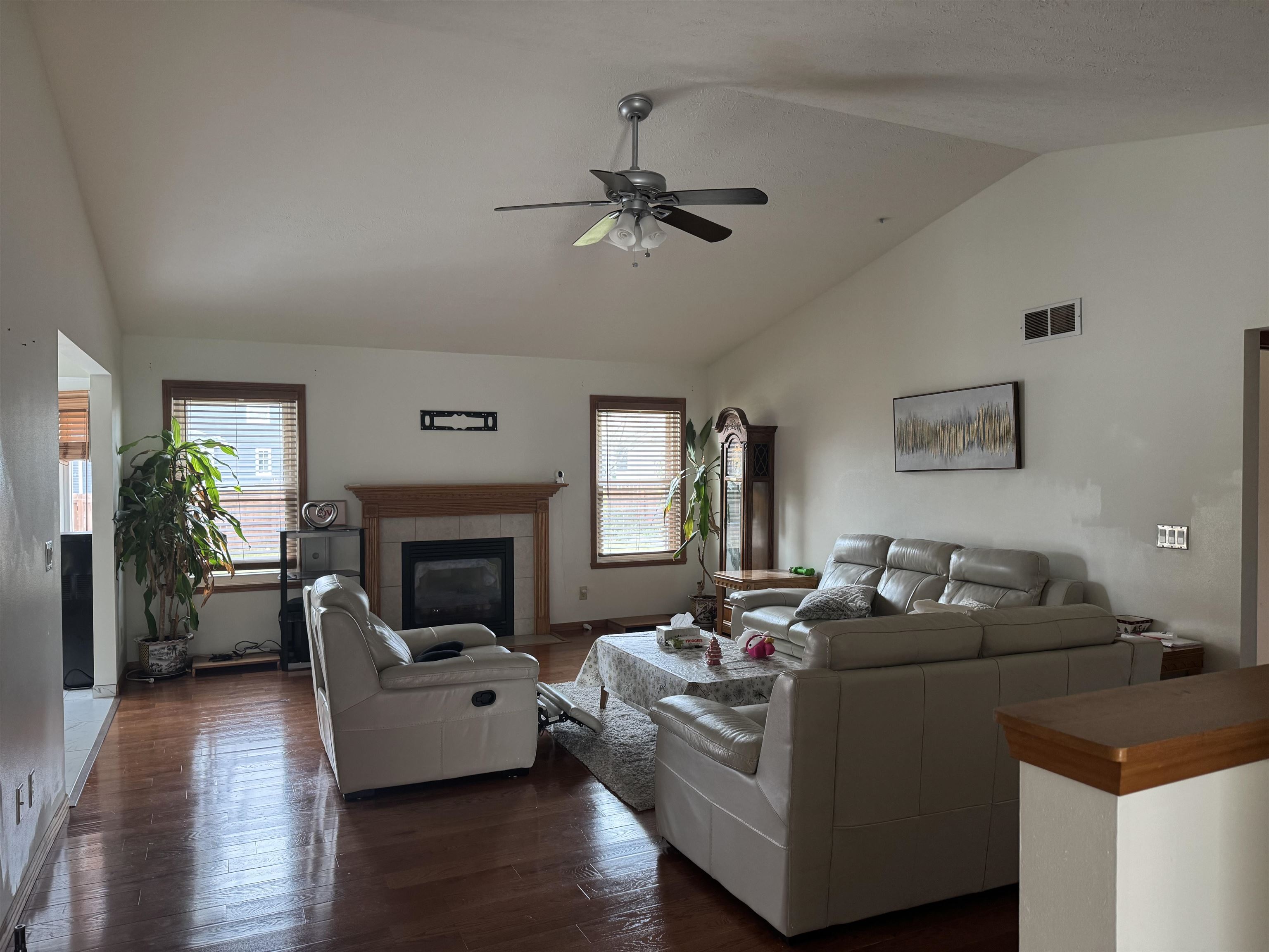 1916 Prestwold Place Machesney Park, IL 61115 - Photo 2 of 9 a living room with furniture and a fireplace