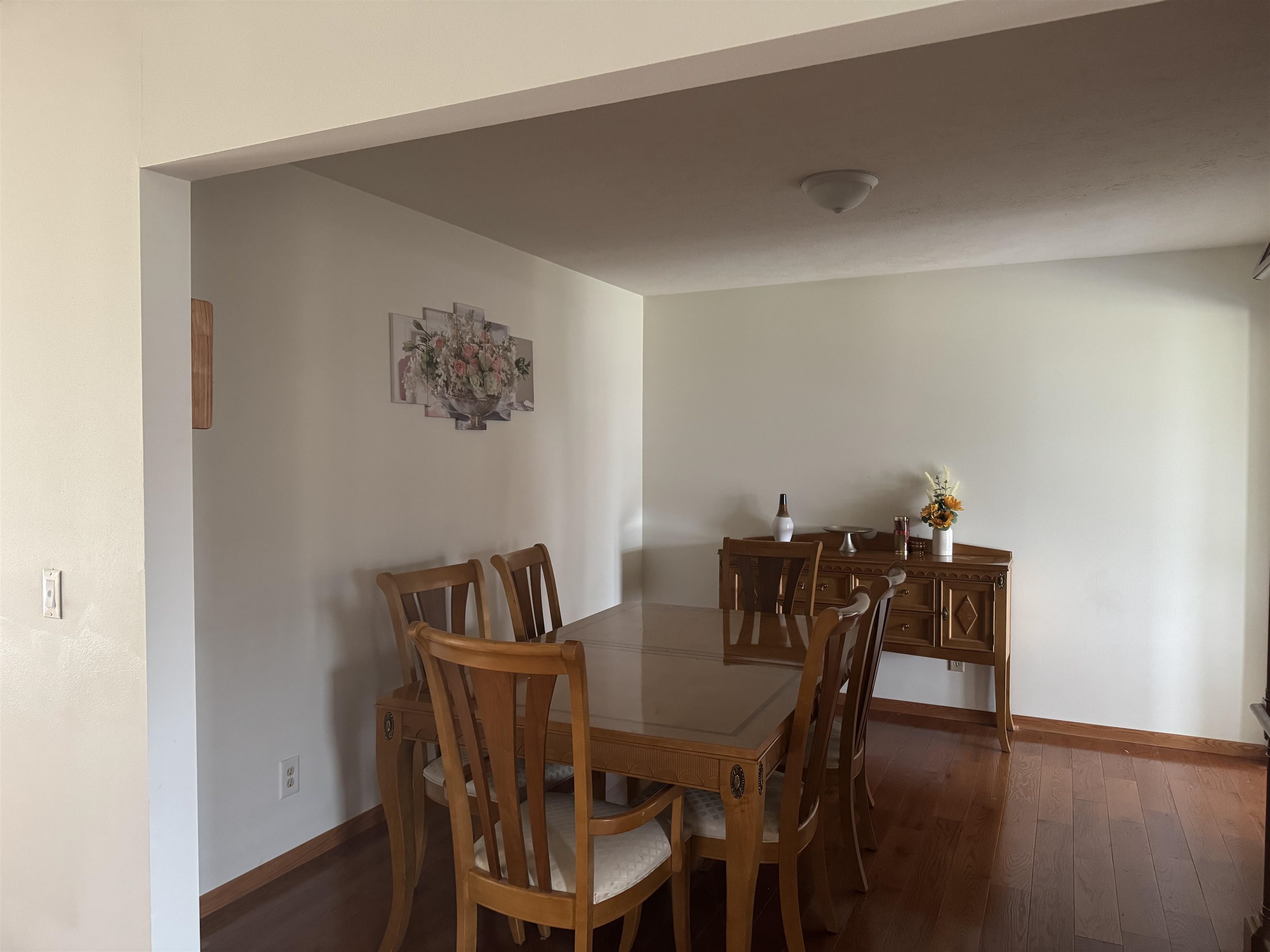 1916 Prestwold Place Machesney Park, IL 61115 - Photo 3 of 9 a view of a dining room with furniture and wooden floor